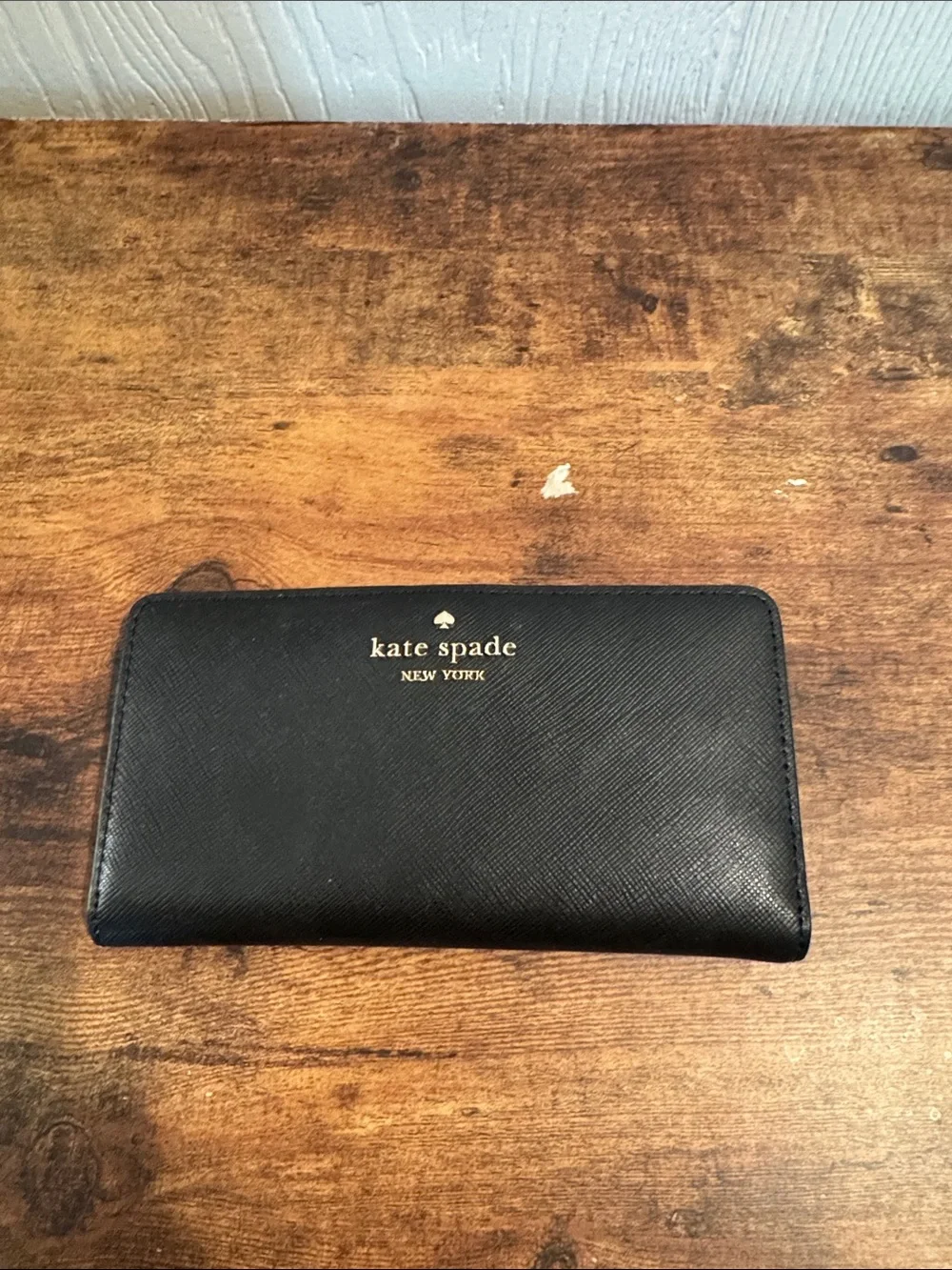 kate spade Black Saffiano Zip Around Wallet with Gold Logo